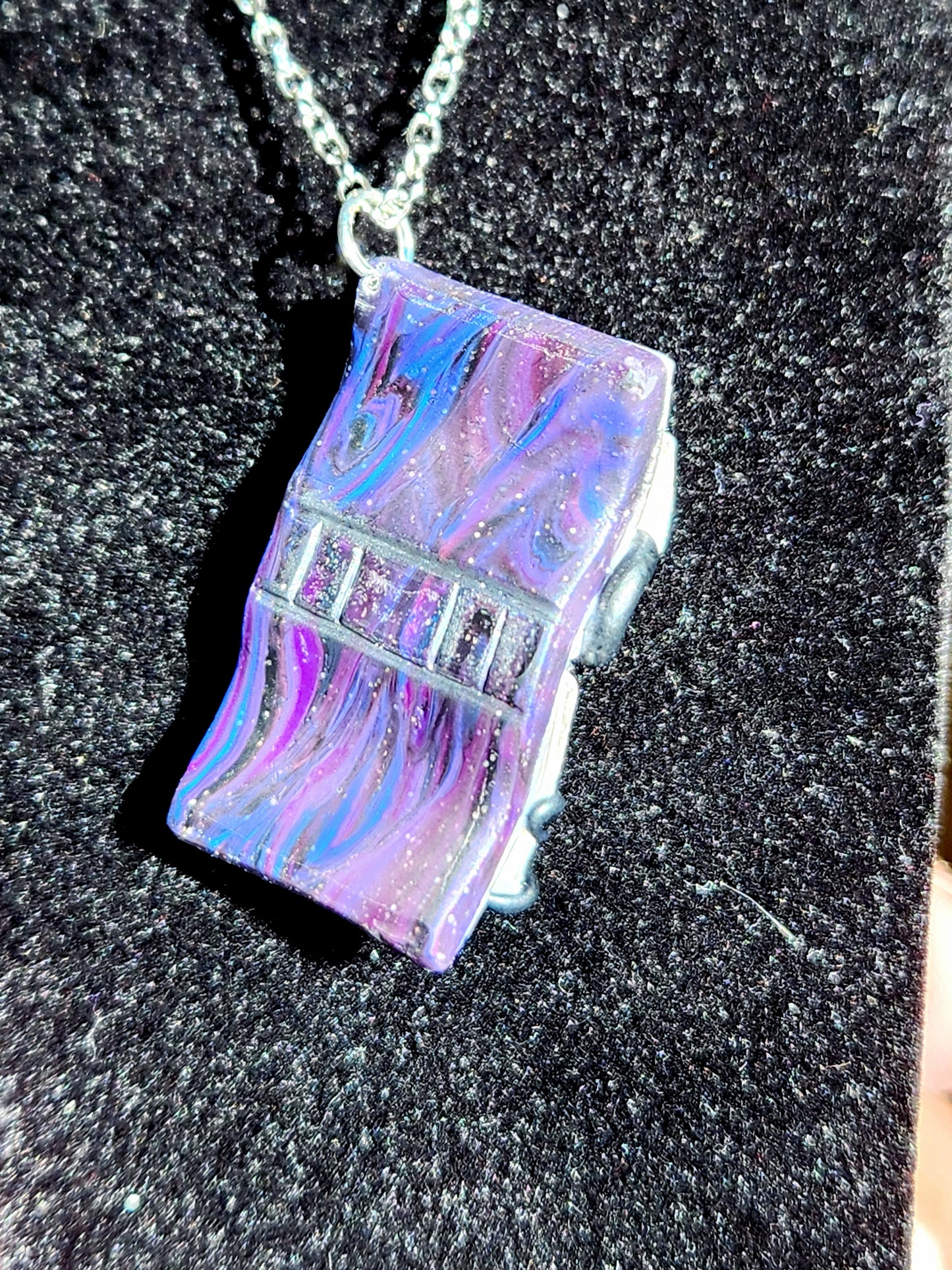A6: Book with Creature pendant