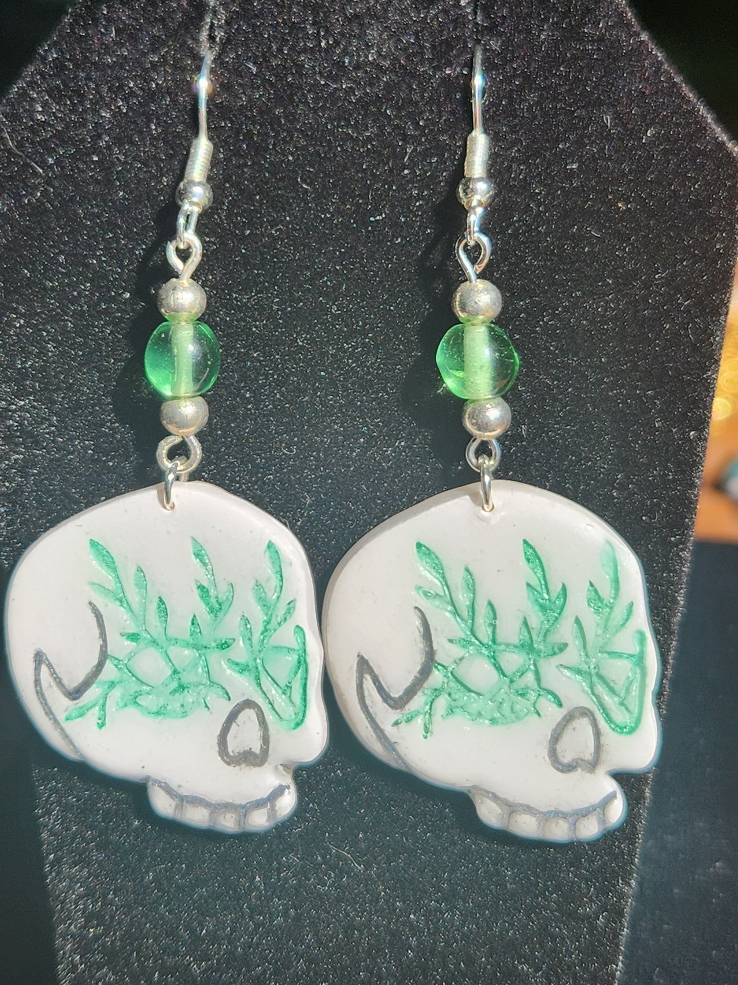 A1: Green skull earrings